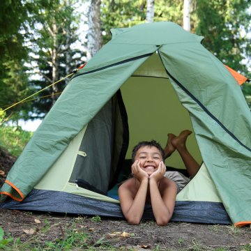 child in tent smiling backpacking tents